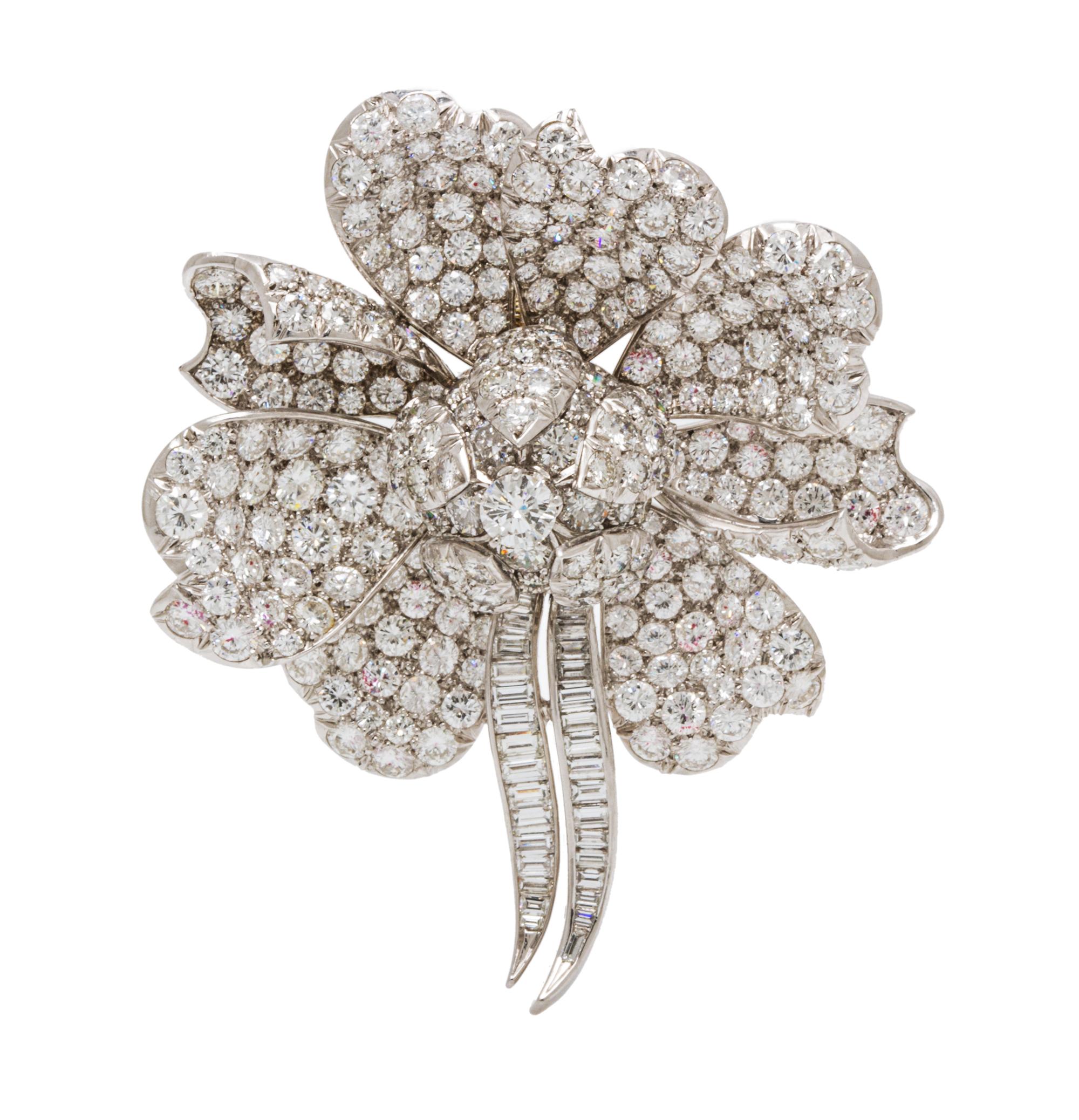 A Platinum and Diamond Flower Pendant/Brooch, 21.50 dwts.
