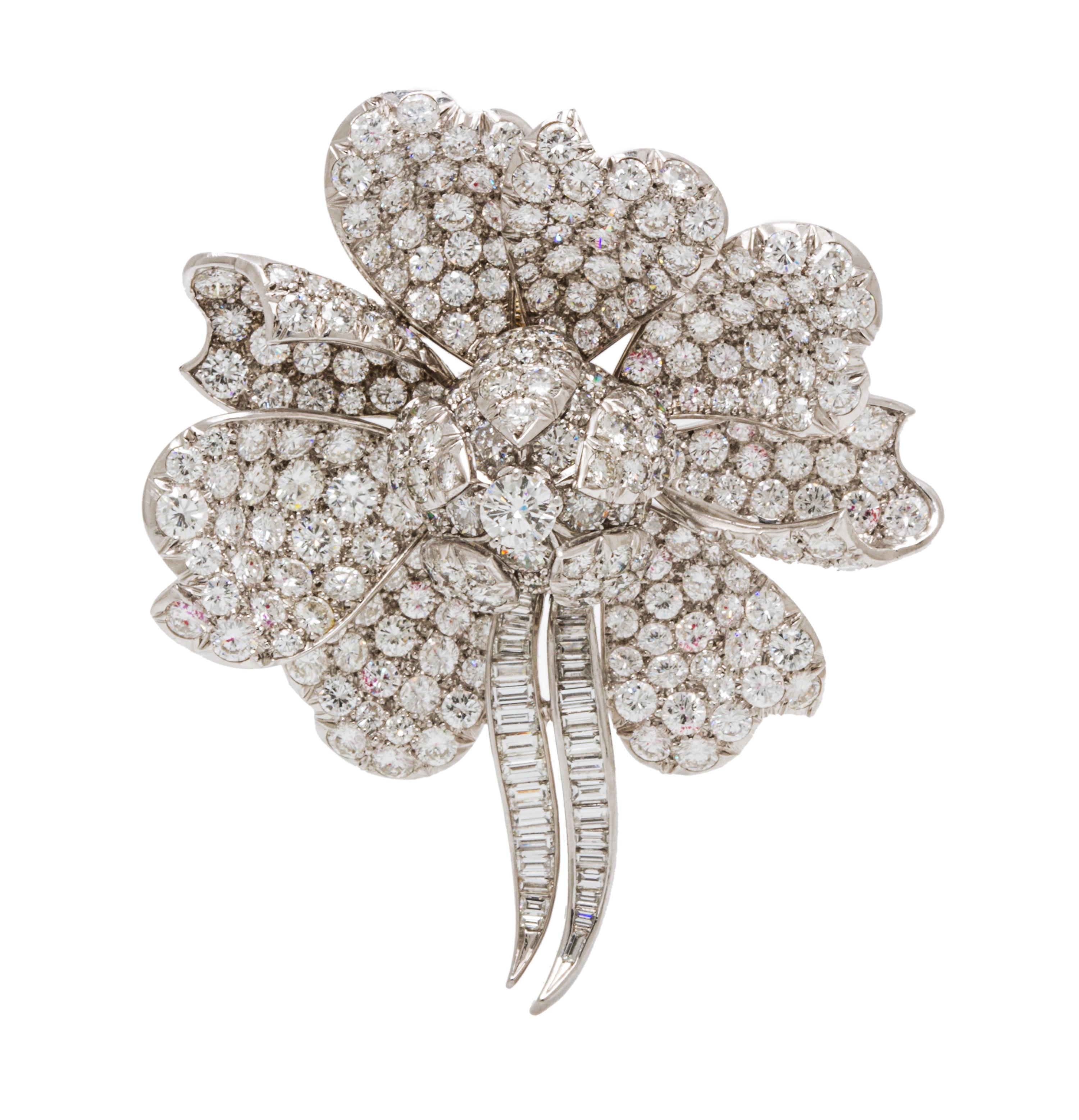 A Platinum and Diamond Flower Pendant/Brooch, 21.50 dwts.