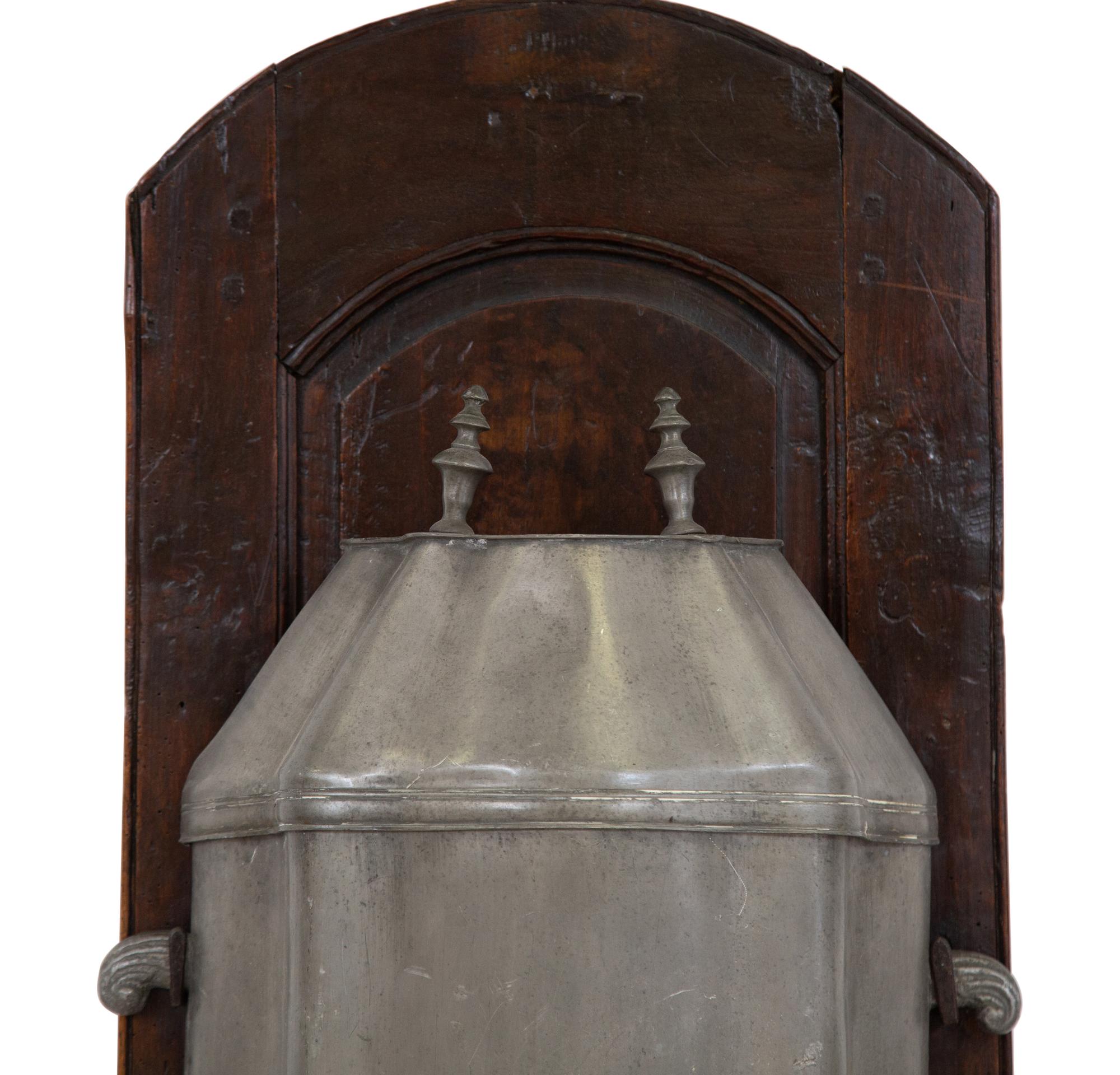 An Italian Carved Walnut Lavabo with Pewter Cistern and Basin