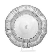 having scalloped rim with engraved decoration and center monogram.