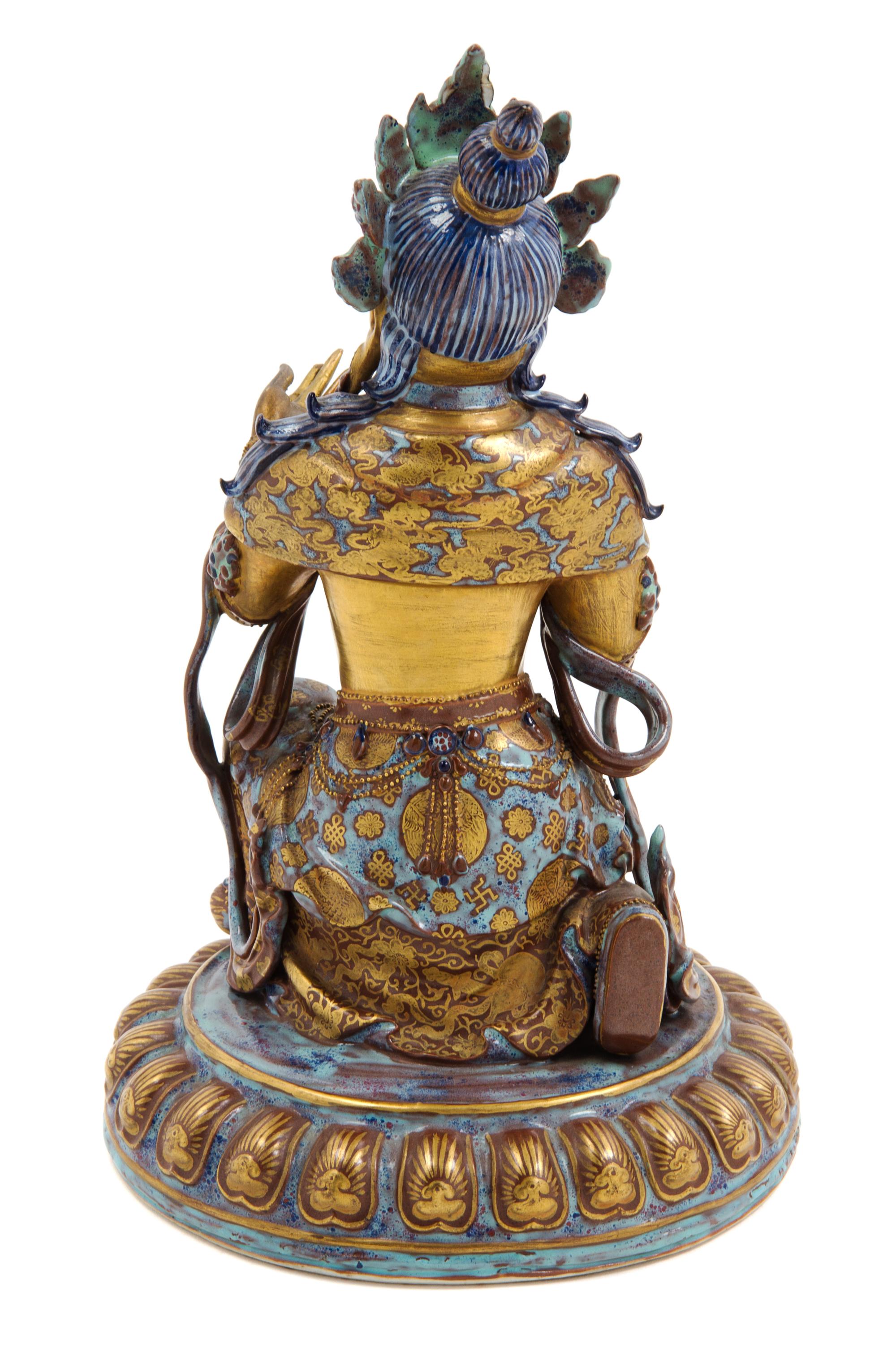 A Gilt Decorated Robin's Egg Glazed Porcelain Figure of Guanyin
