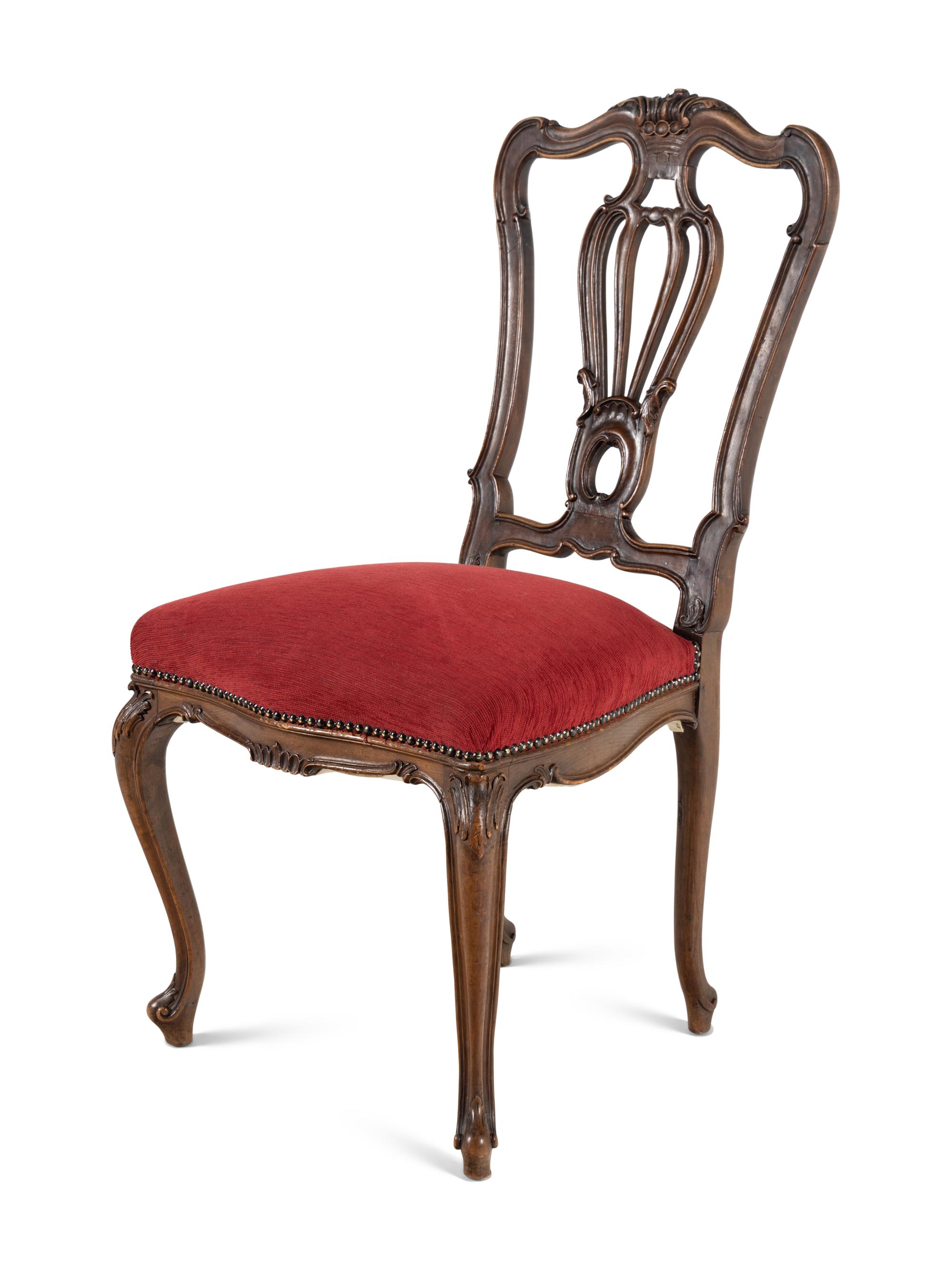 A Set of Five Louis XV Style Carved Walnut Dining Chairs