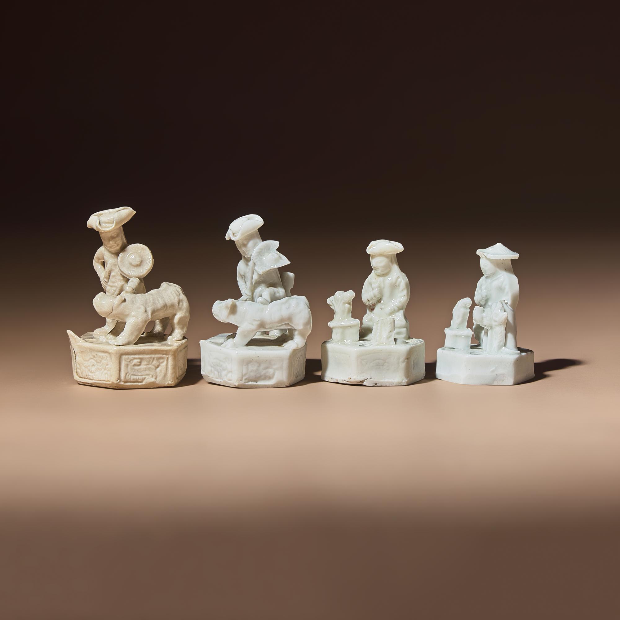 Four Miniature Chinese Blanc-de-Chine Porcelain 'European' Whistles, Late 17th-Early 18th Century — 清中期 德化白瓷西人鬥獸哨四件