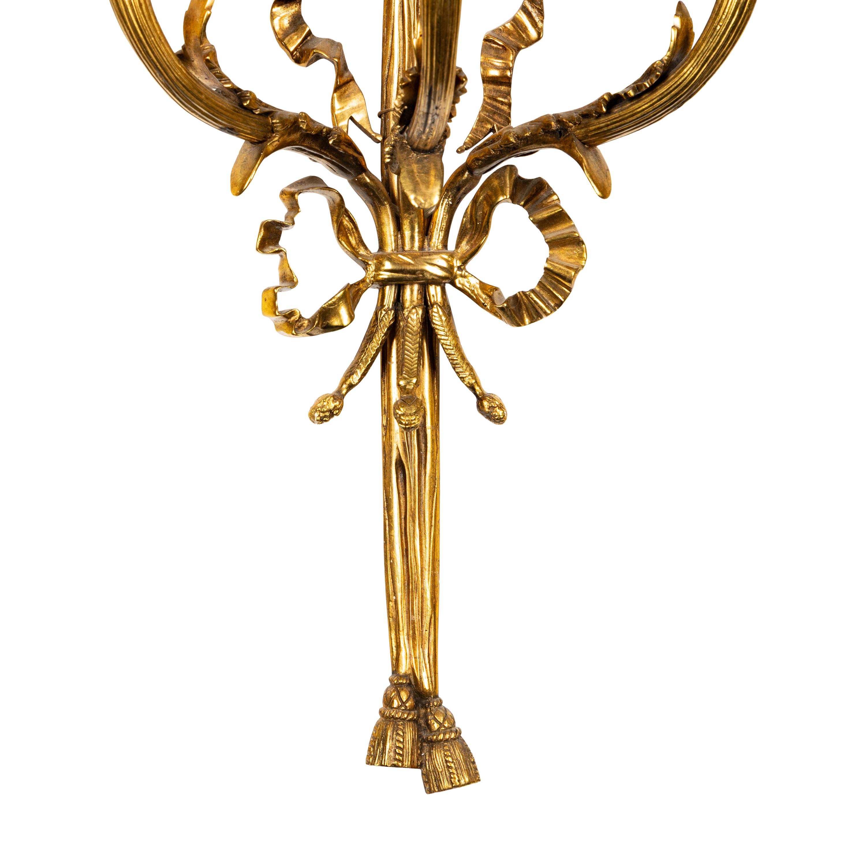 A Set of Four Gilt Bronze and Jasperware Mounted Three-Light Sconces