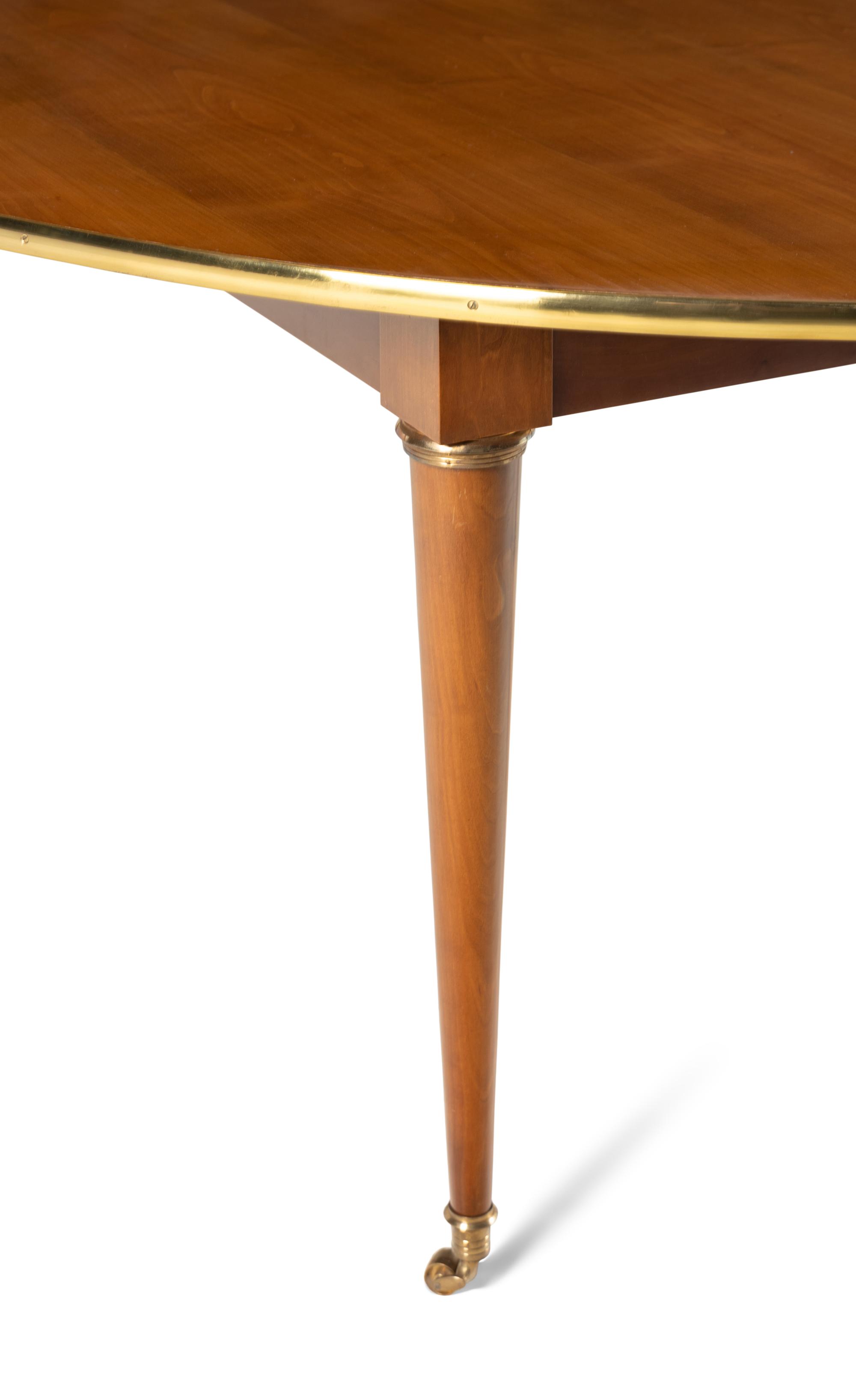 A Directoire Style Brass Mounted Walnut Dining Table