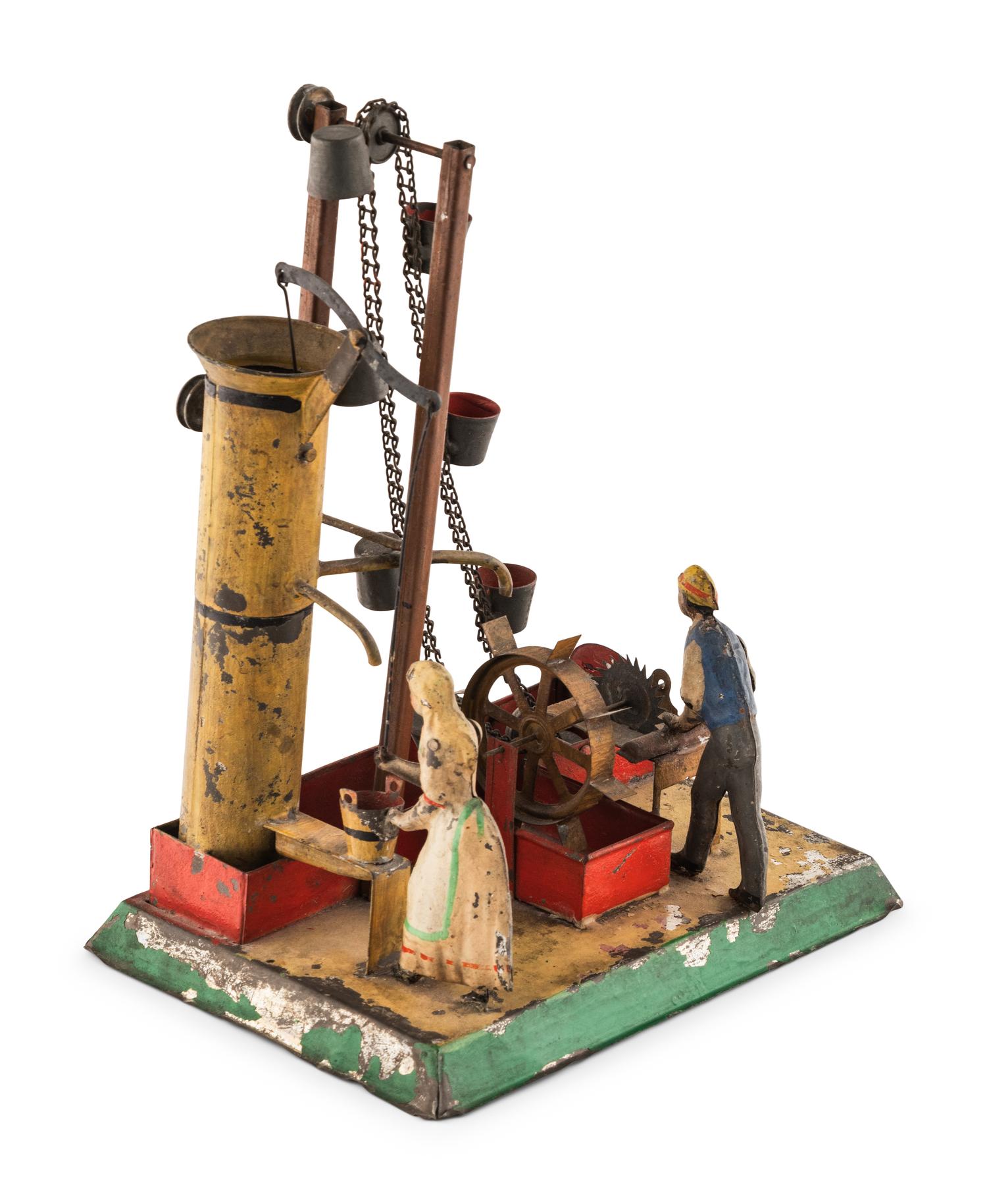 An Early Tin Water Elevator Toy