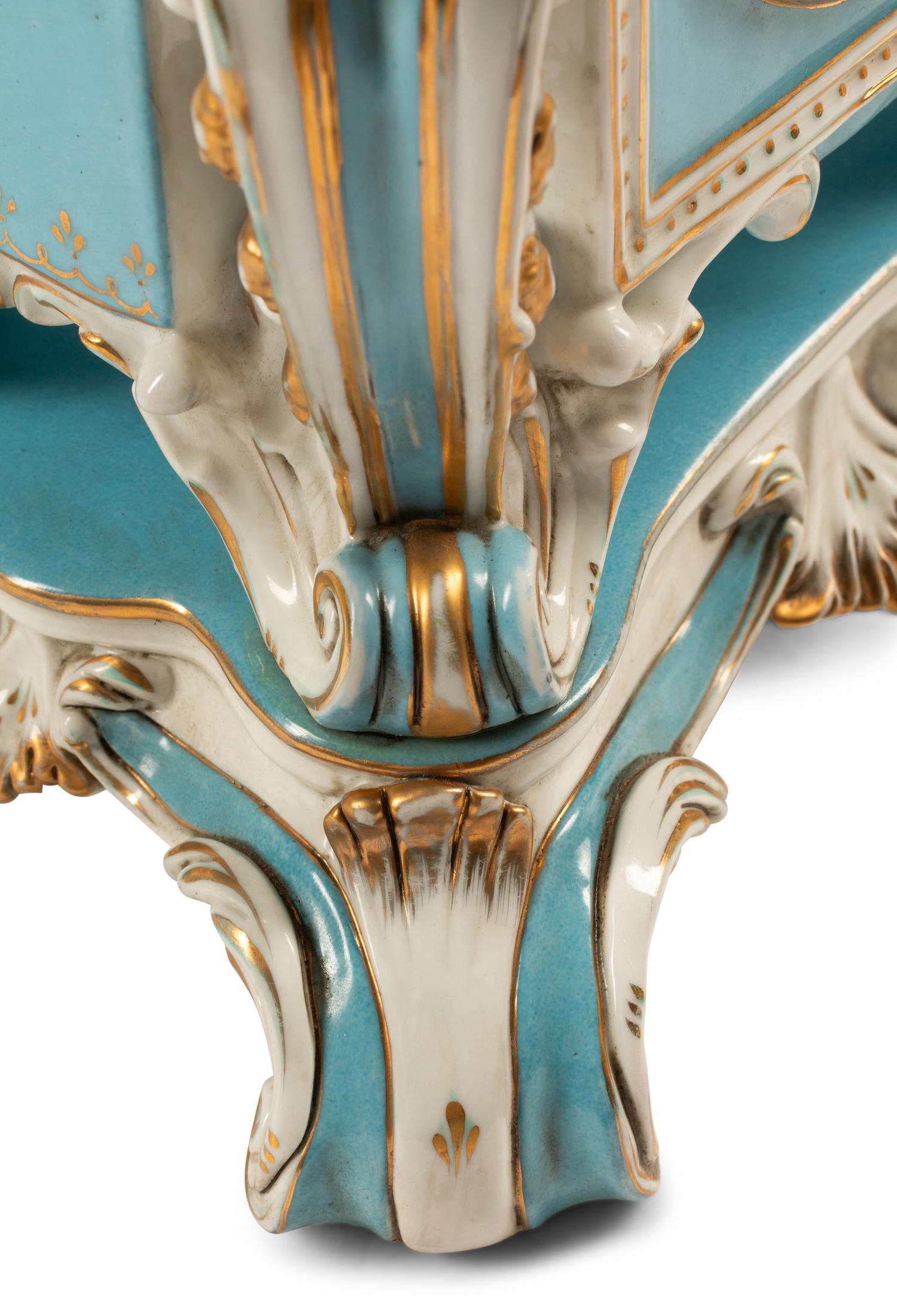 A Pair of Sevres Style Porcelain Cache Pots