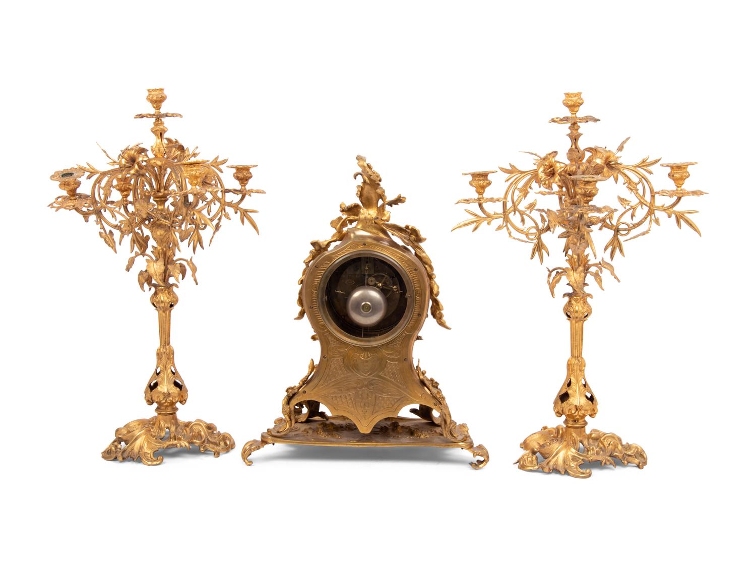 A Louis XV Style Gilt Bronze Clock Garniture