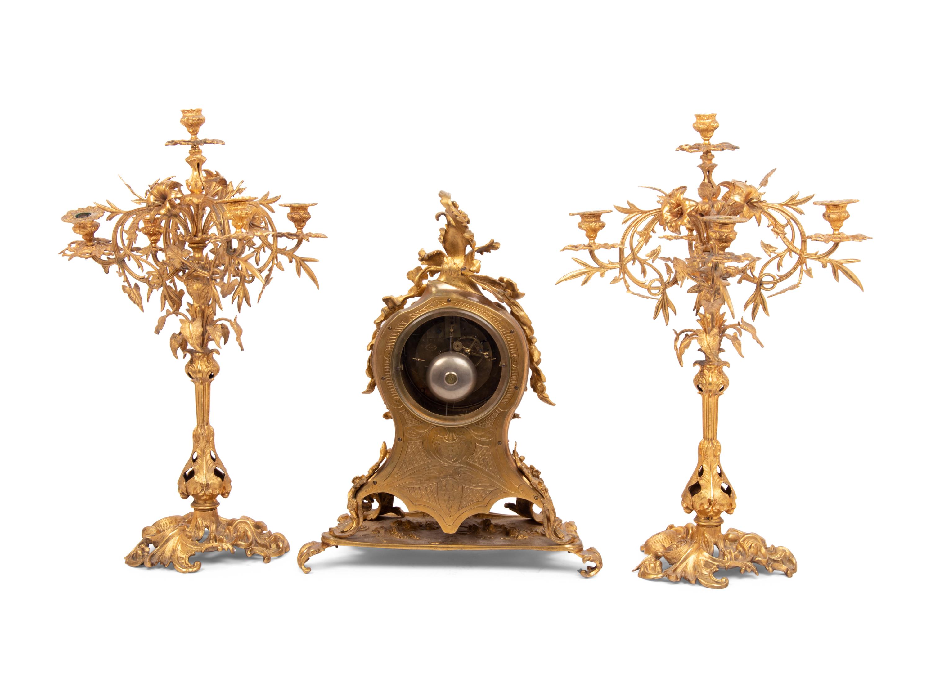 A Louis XV Style Gilt Bronze Clock Garniture