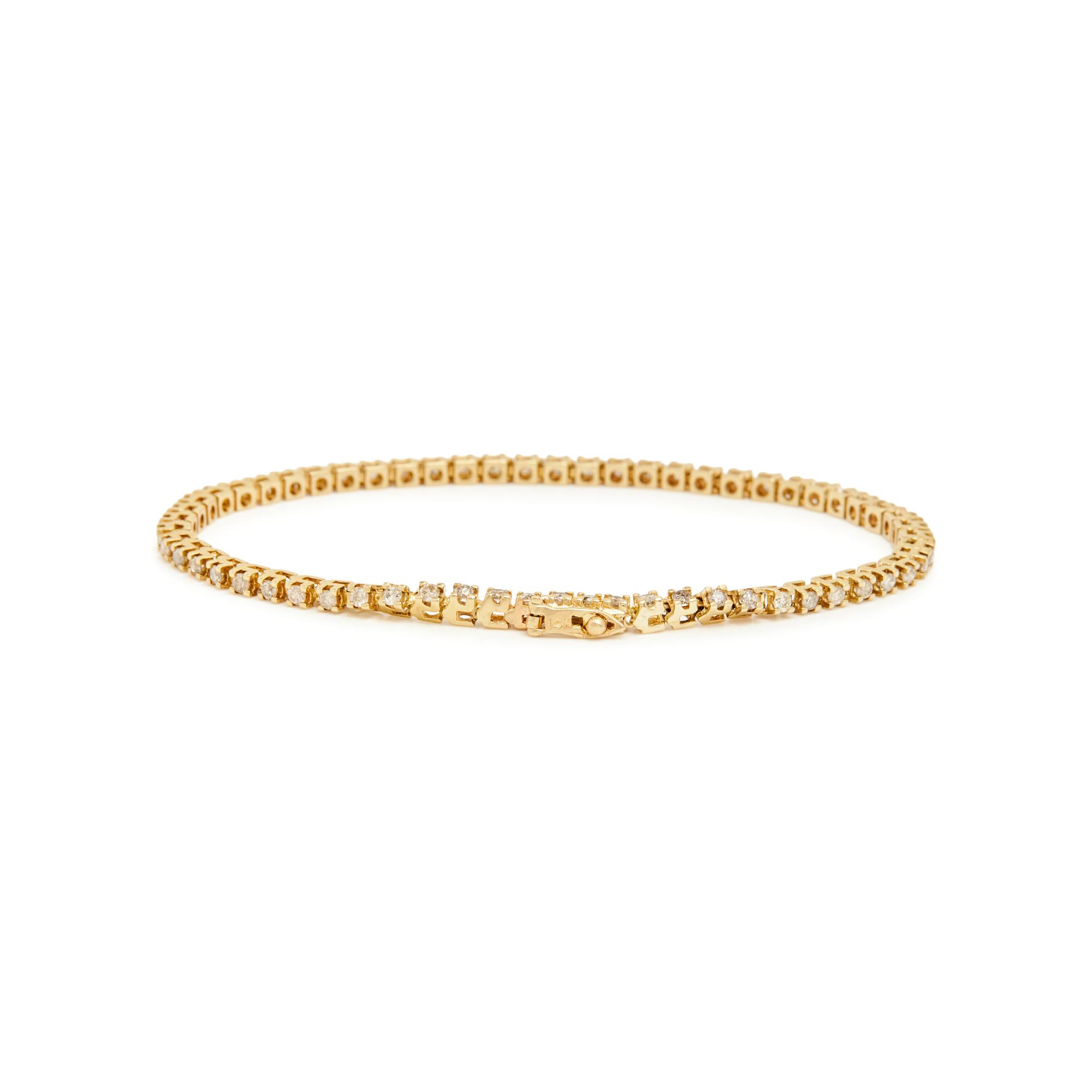 PAIR OF YELLOW GOLD AND DIAMOND LINE BRACELETS