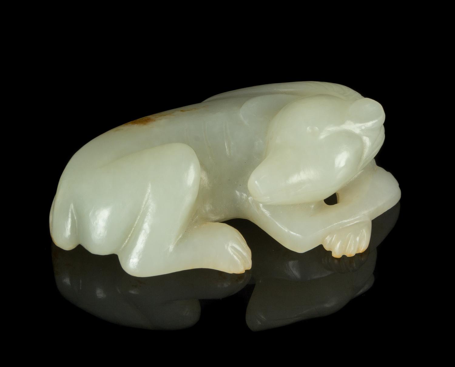 A Carved White Jade Figure of a Dog