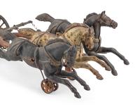 A Cast Iron Fire Engine Three-Horse Train and a Horse Pull Toy