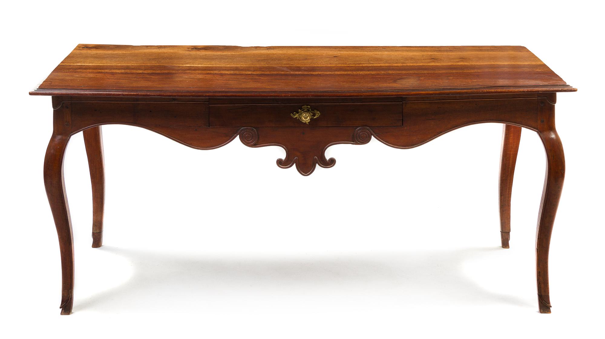 A French Provincial Walnut Library Table, Height 29 x width 65 1/4 x depth 34 inches.