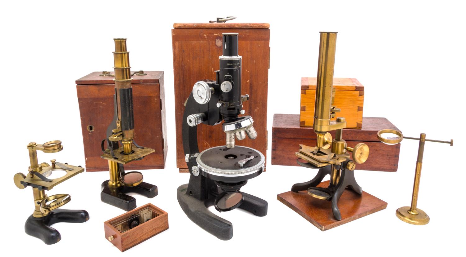 A Group of Four Cased Microscopes Height of first 12 3/4 inches. — 20TH CENTURY