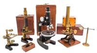 A Group of Four Cased Microscopes Height of first 12 3/4 inches. — 20TH CENTURY