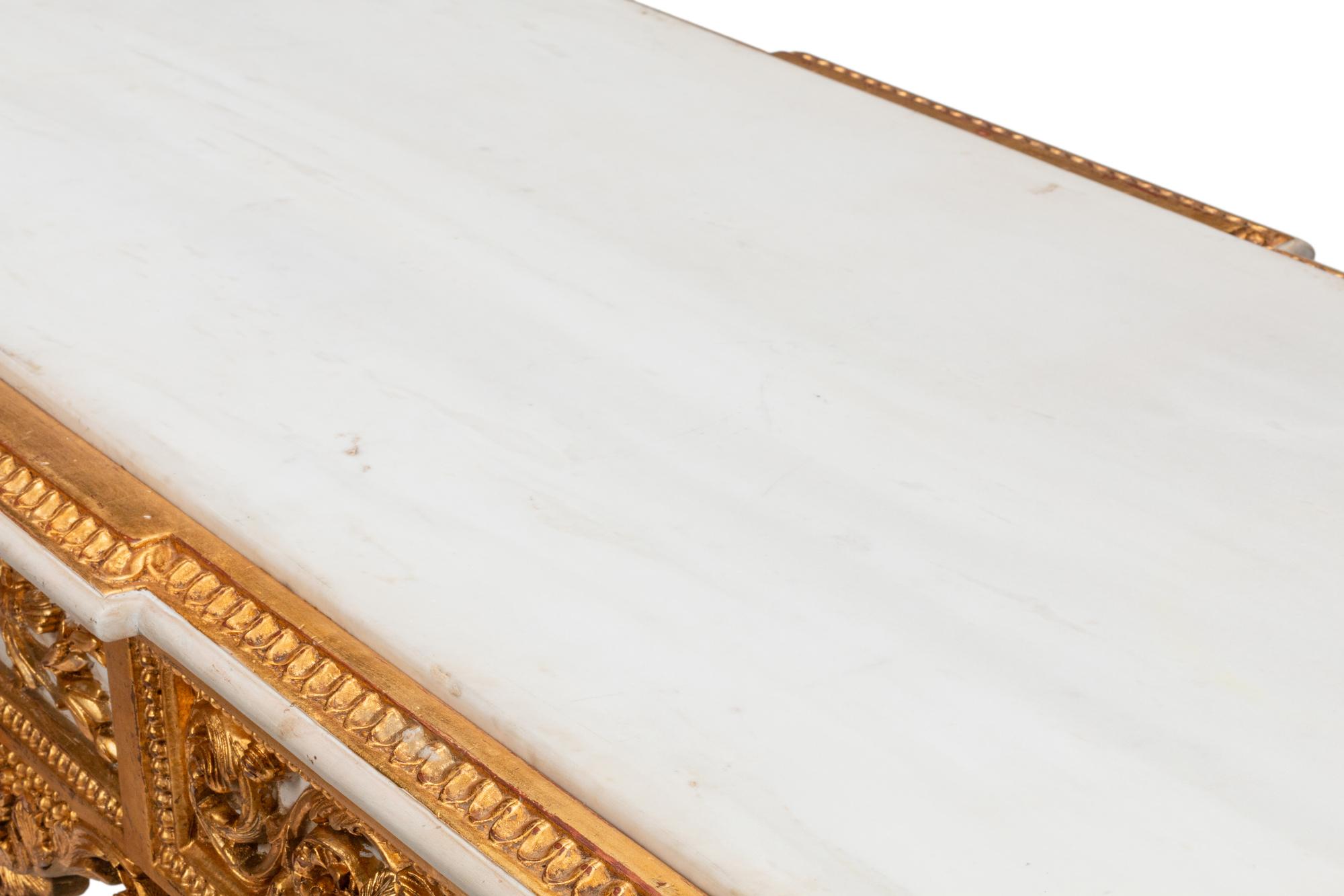 A Pair of Louis XVI Style White Painted and Parcel Gilt Marble-Top Console Tables
