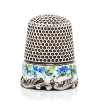 An American Silver and Enamel Thimble, Ketcham & McDougall, New York, NY, the knurled top and body above a white enamel band having pol