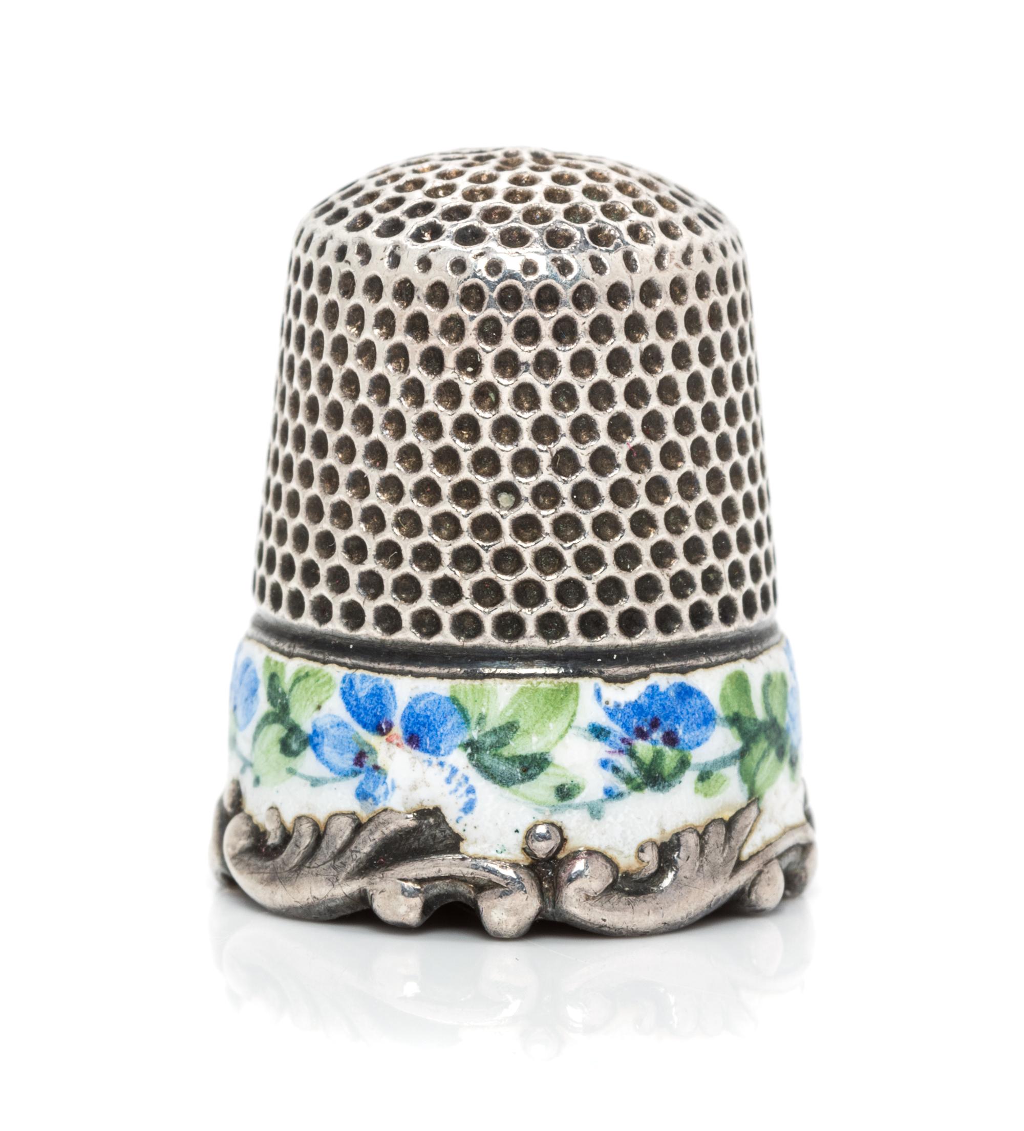 An American Silver and Enamel Thimble, Ketcham & McDougall, New York, NY, the knurled top and body above a white enamel band having pol