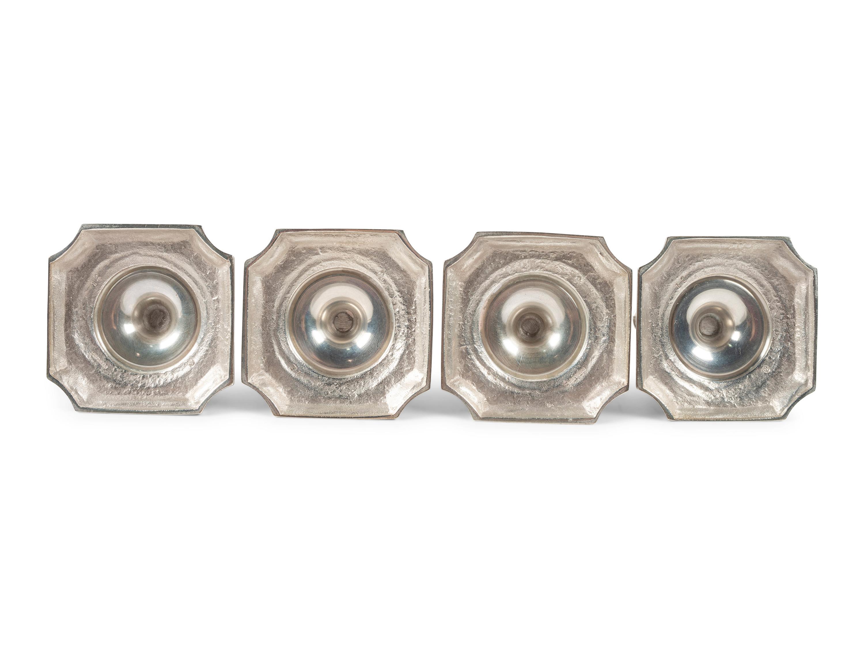 A Set of Four Currier & Roby Silver Taper Sticks