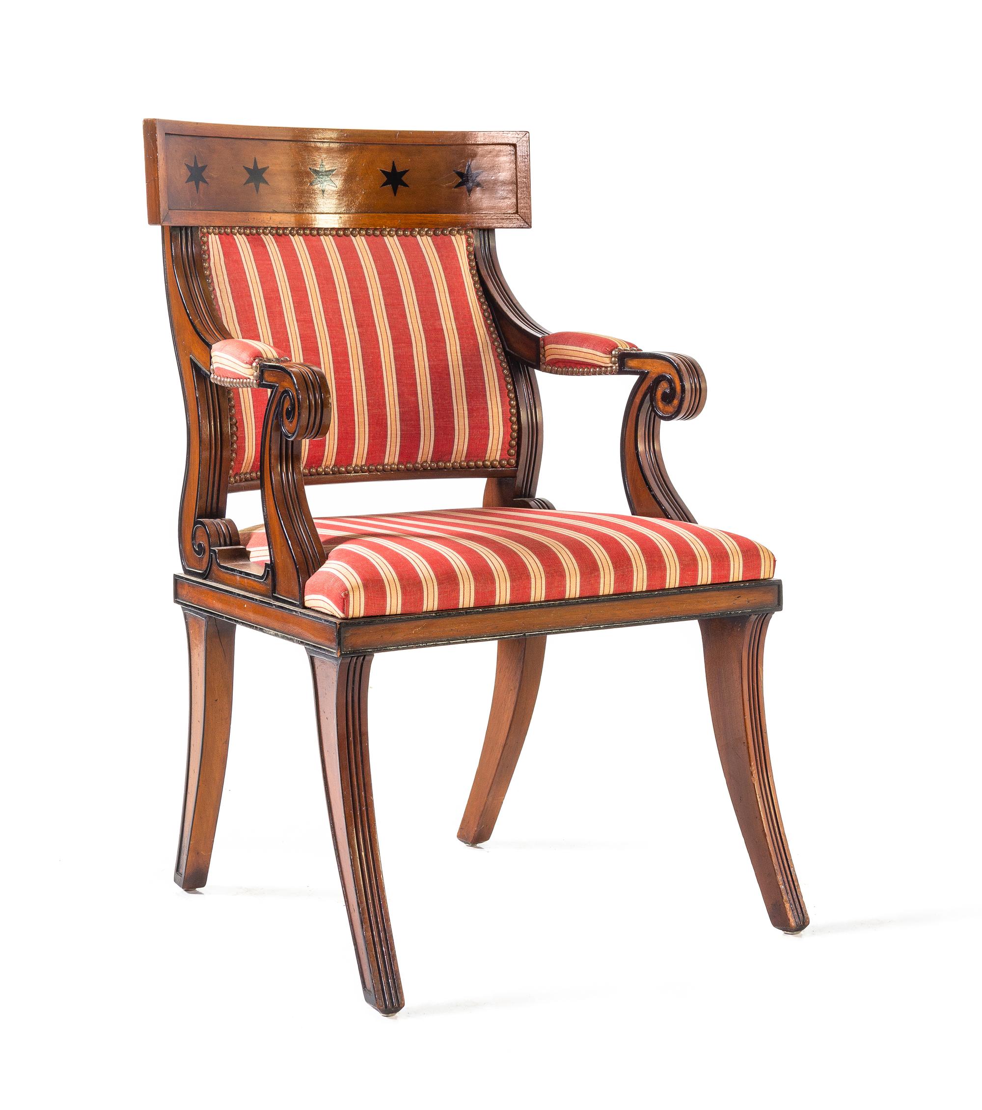 A Set of Sixteen Regency Style Parcel Ebonized Mahogany Dining Chairs