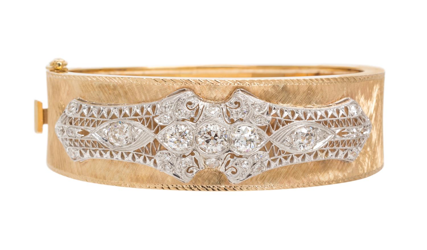 A Platinum, Yellow Gold and Diamond Bangle, 30.50 dwts.