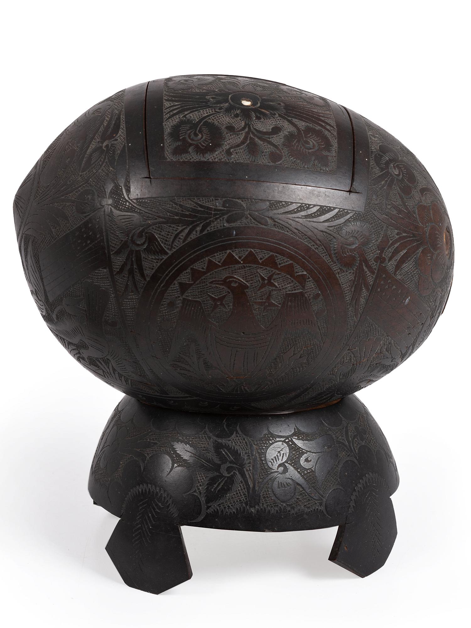 [AMERICANA]. Patriotic carved coconut shell with display stand.