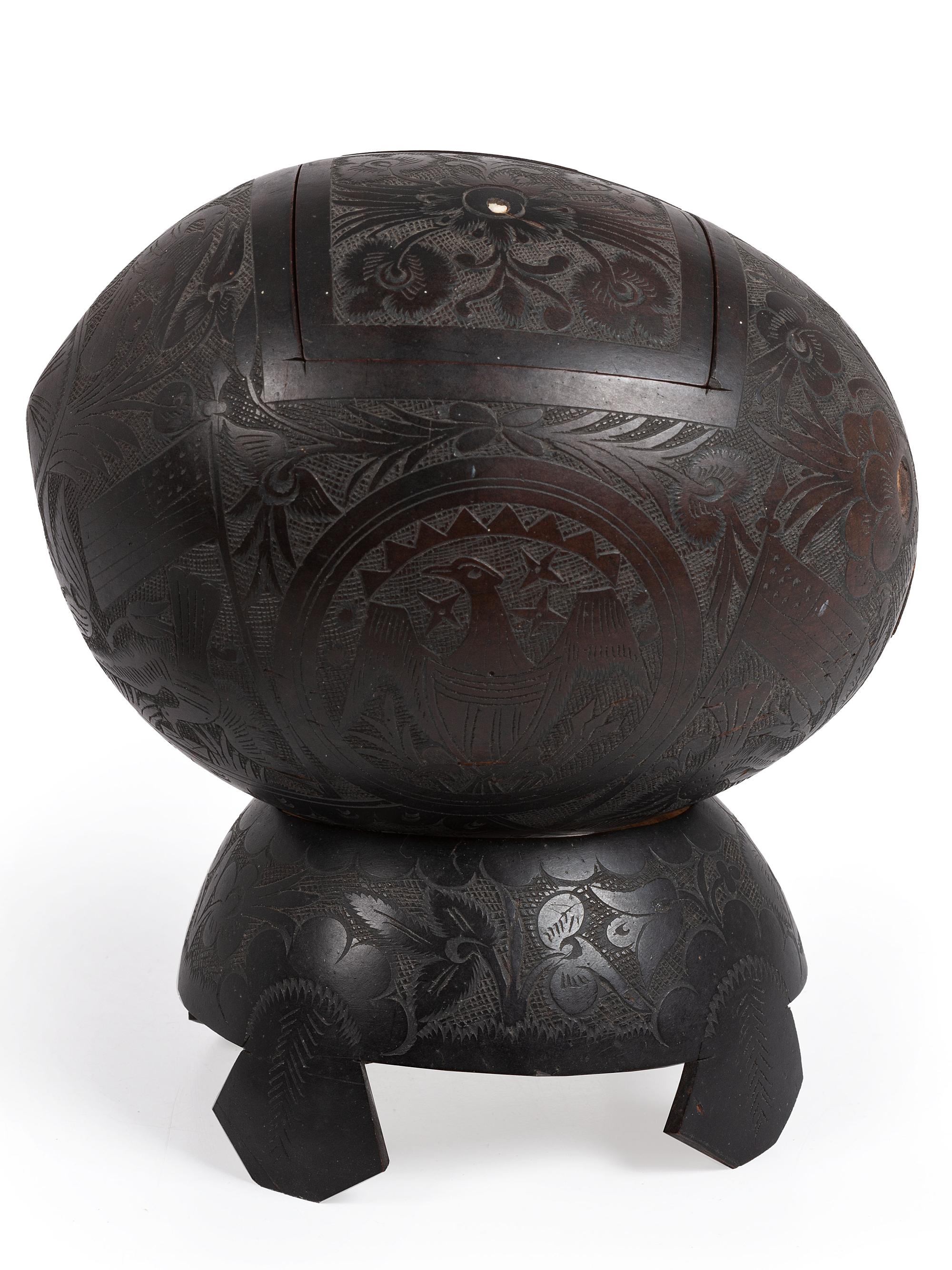 [AMERICANA]. Patriotic carved coconut shell with display stand.