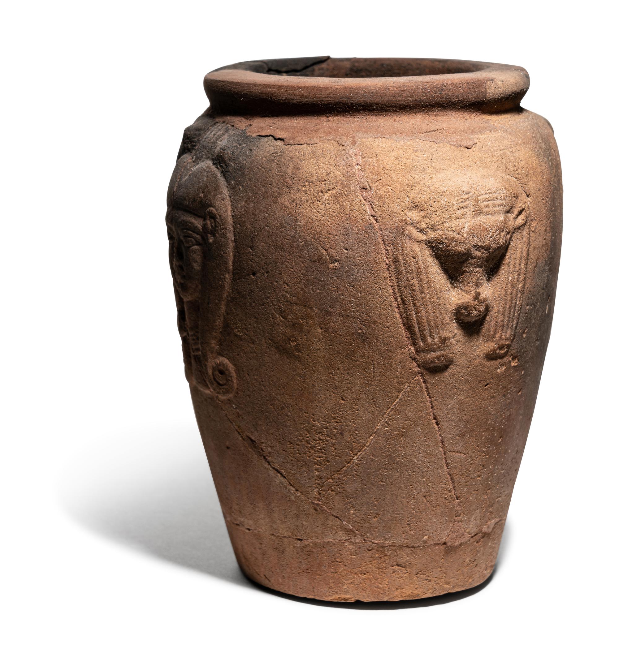 An Egyptian Pottery Jar with Head of Hathor