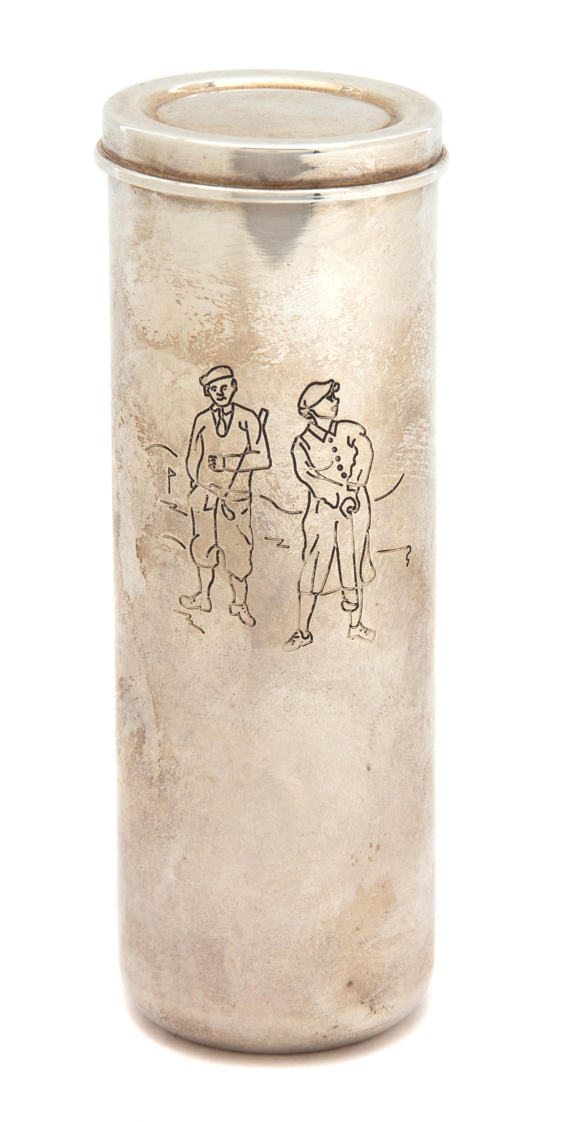 An Italian Silver Golf Ball Case, Tiffany & Co., of cylindrical form, etched with a small scene of two golfers, with a snap on lid