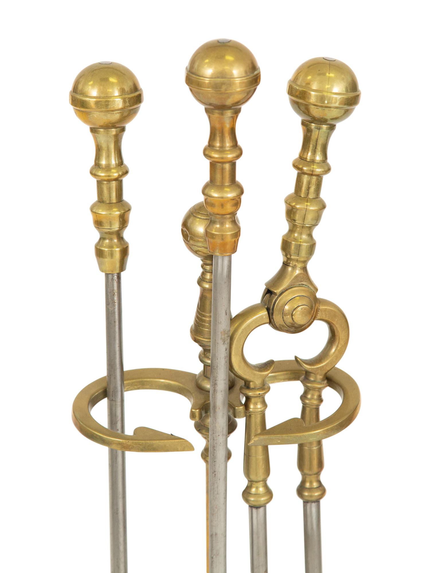 Two Sets of Brass Fire Tools and a Pair of Brass Andirons