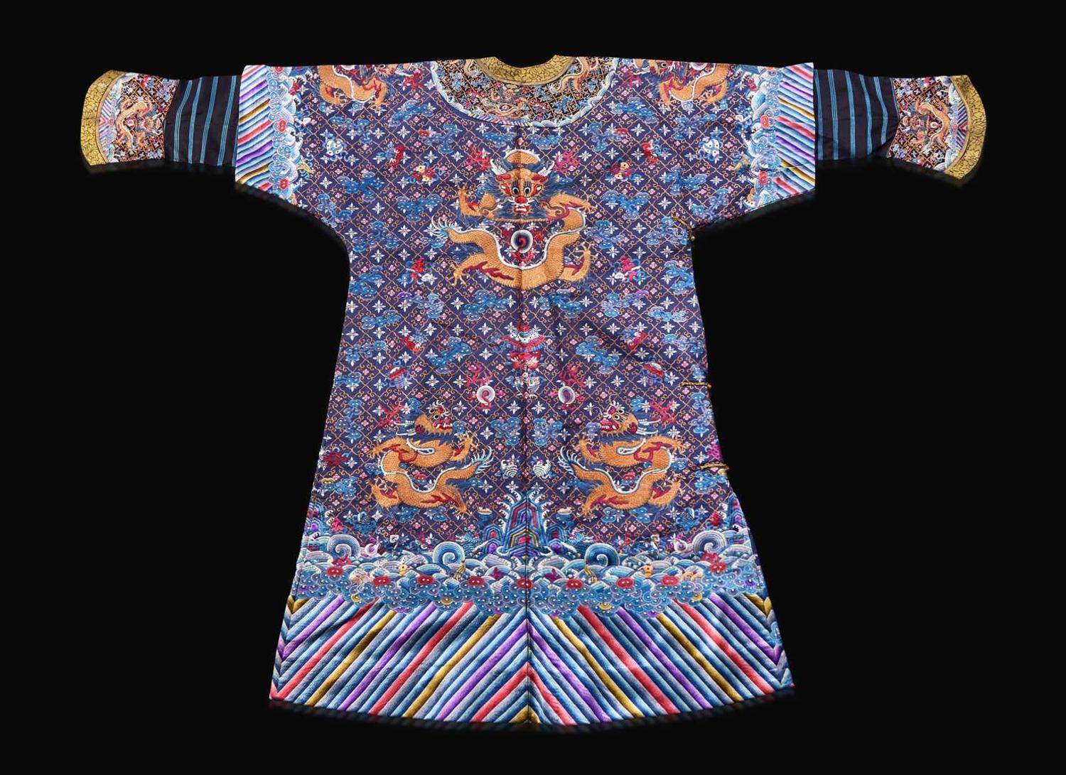 A Chinese embroidered blue silk "Nine-Dragon robe, Qing dynasty, circa 1900 海水江崖九龍紋袍 清 約1900年