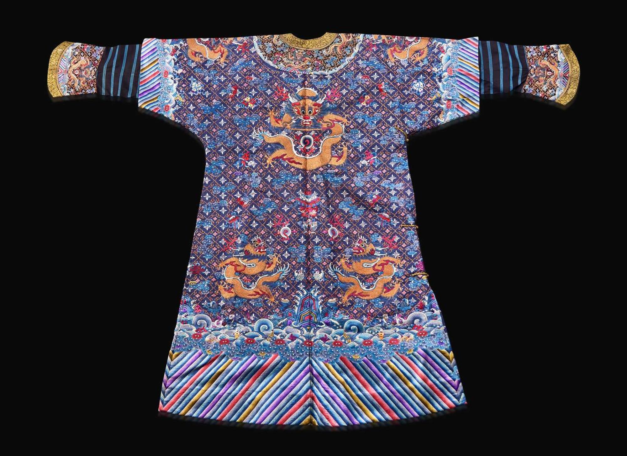 A Chinese embroidered blue silk "Nine-Dragon robe, Qing dynasty, circa 1900 海水江崖九龍紋袍 清 約1900年