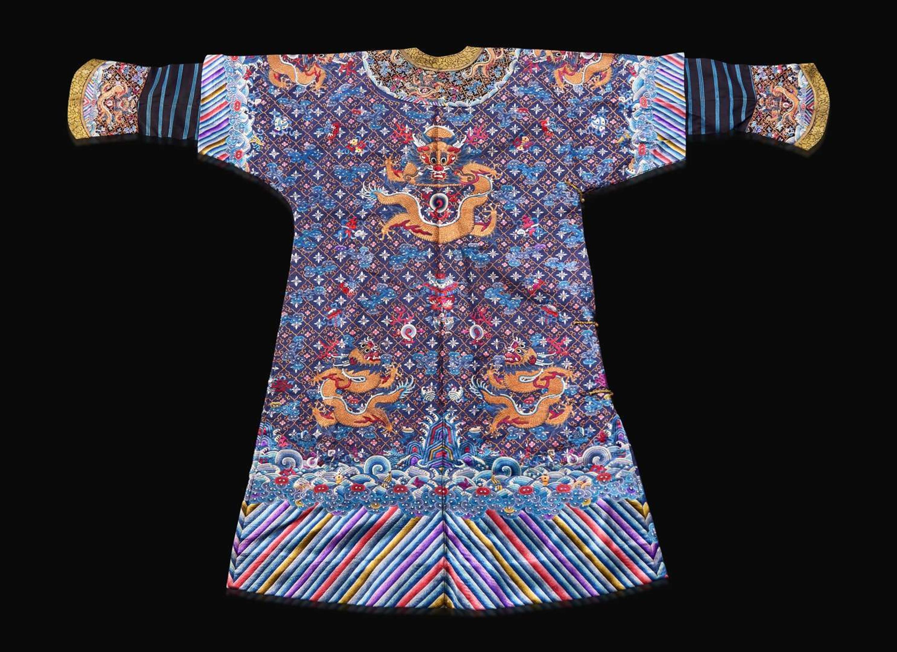 A Chinese embroidered blue silk "Nine-Dragon robe, Qing dynasty, circa 1900 海水江崖九龍紋袍 清 約1900年