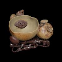 A Rare Chinese Yixing 'Peach and Pomegranate' Coupe Inscribed 'Chen Minyuan Zuo' and Carved Wood Stand 陳鳴遠款段泥紫砂桃榴杯