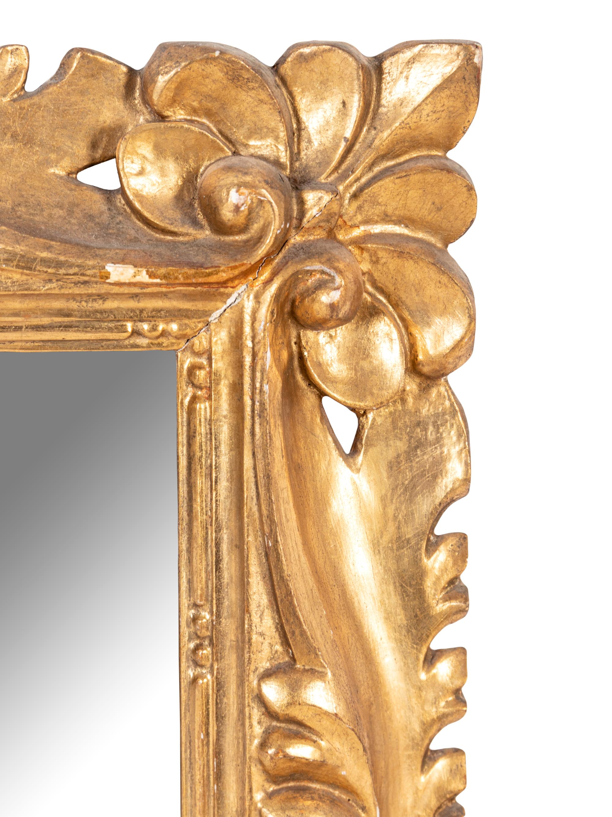 An Italian Baroque Style Giltwood Mirror