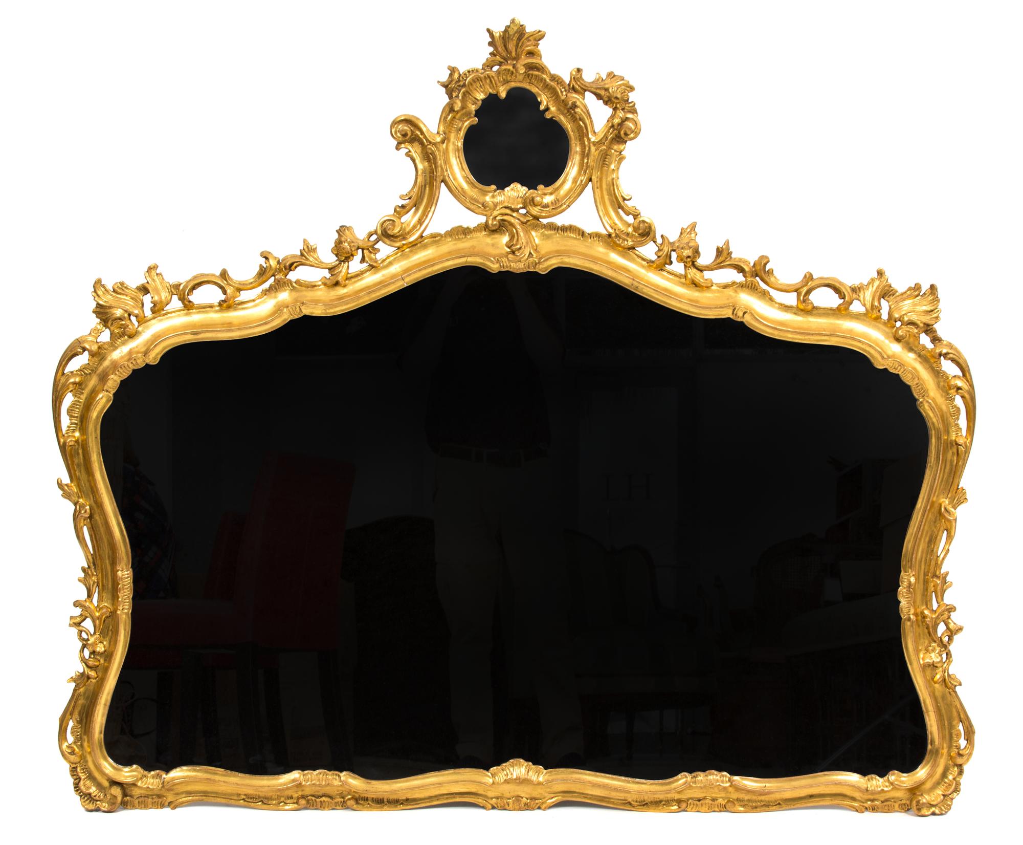 An Italian Rococo Style Giltwood Wall Mirror Height 45 x width 51 inches. — 19TH CENTURY