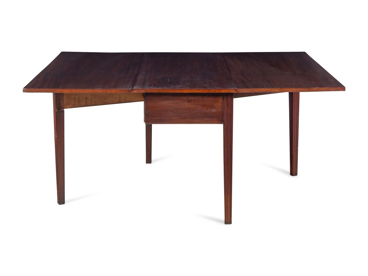 A George III Figured and Channel-Molded Mahogany Drop-Leaf Dining Table