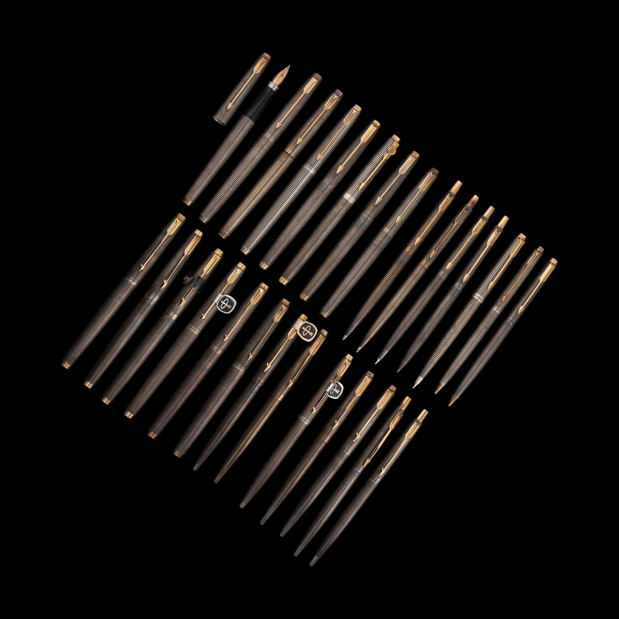 A Set of Twenty-Eight Silver Parker Writing Instruments
