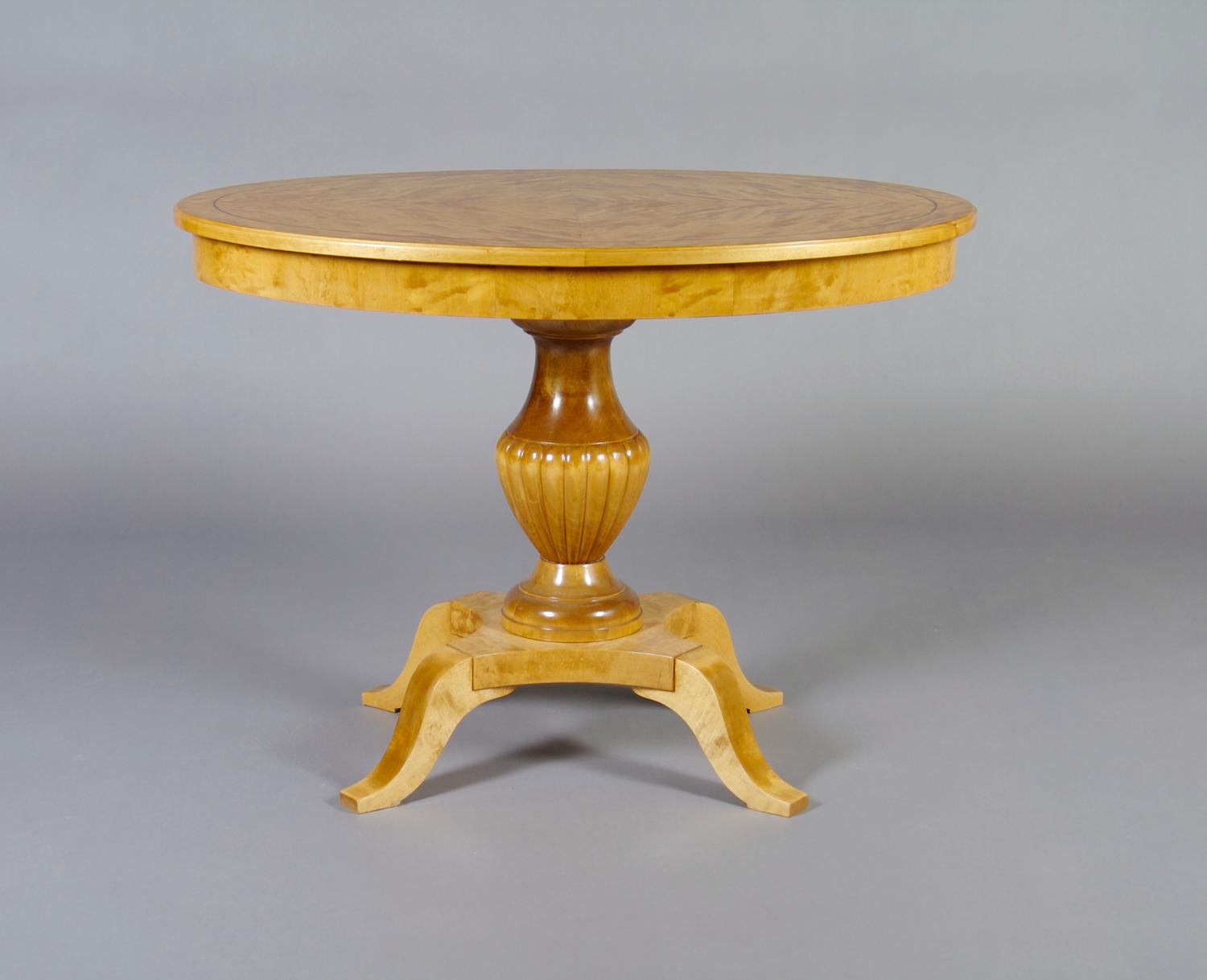 A Swedish Neoclassical Birch Center Table, Height 28 1/4 x width 39 x depth 27 1/2 inches.