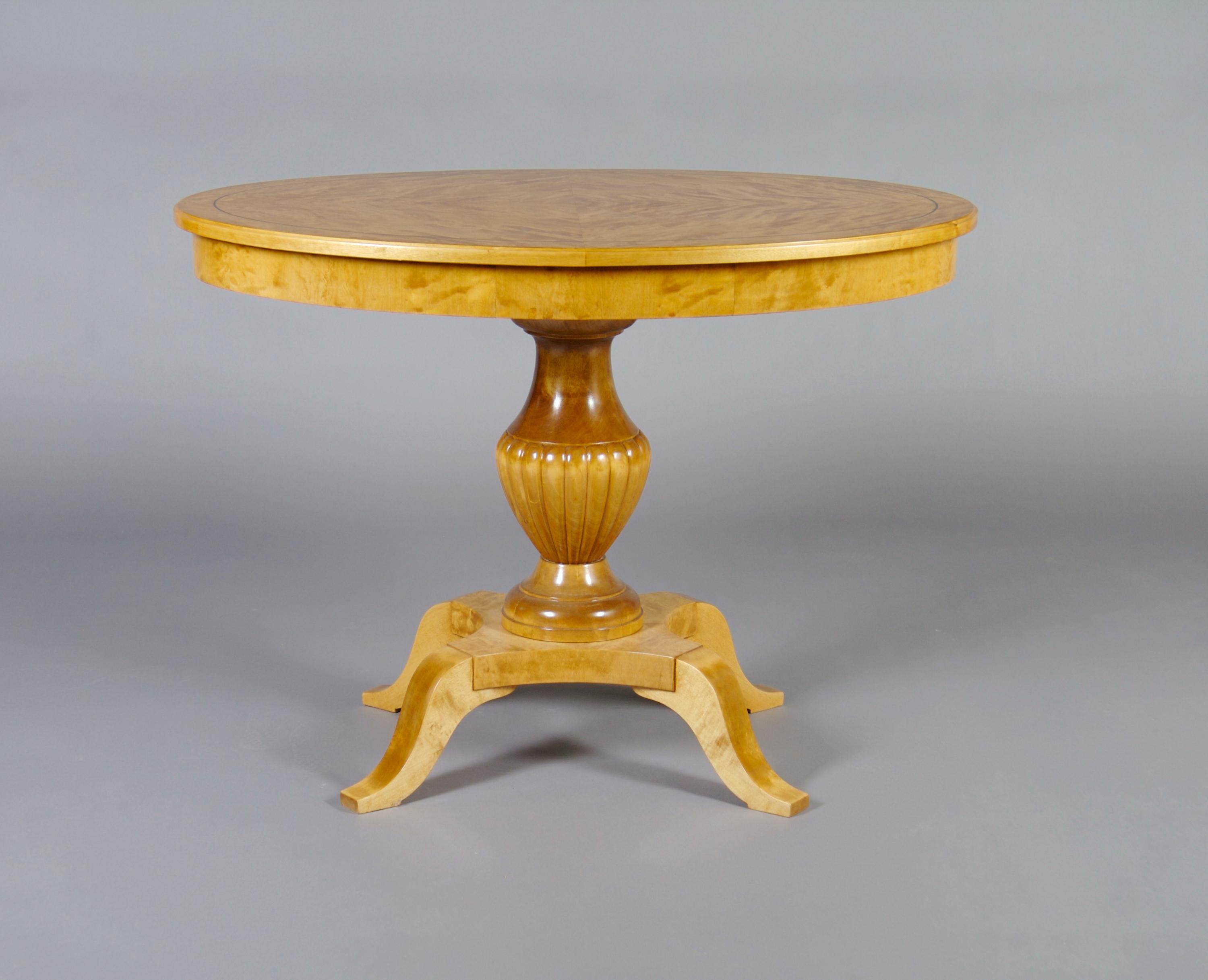 A Swedish Neoclassical Birch Center Table, Height 28 1/4 x width 39 x depth 27 1/2 inches.