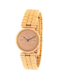 CORUM, YELLOW GOLD AND US $5 COIN WRISTWATCH