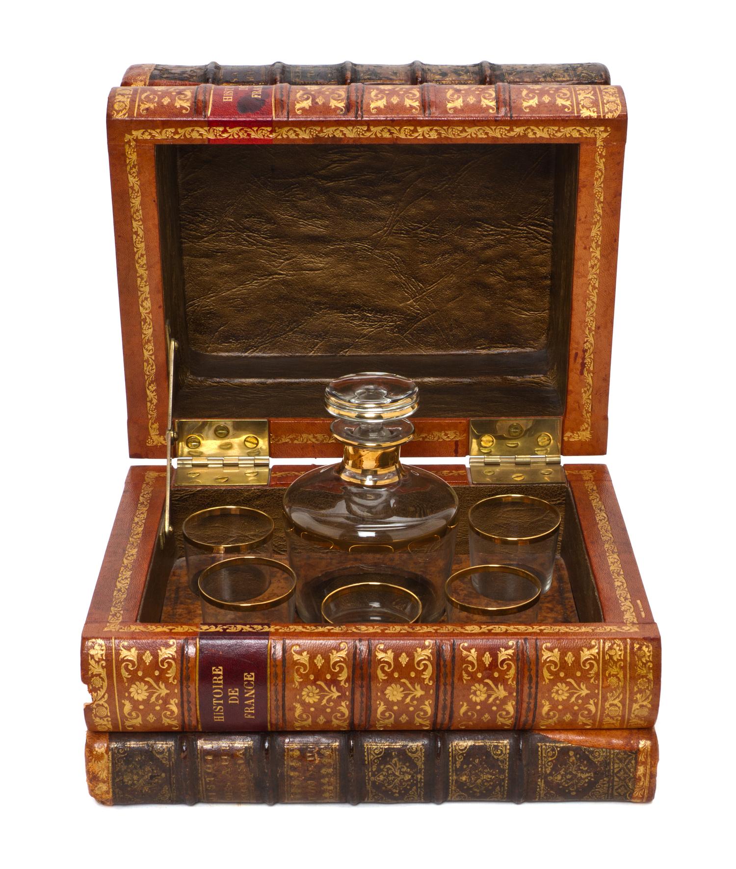 A French Book Form Decanter Set, Height 7 1/2 x width 10 1/8 x depth 8 inches.