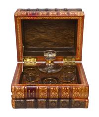A French Book Form Decanter Set, Height 7 1/2 x width 10 1/8 x depth 8 inches.