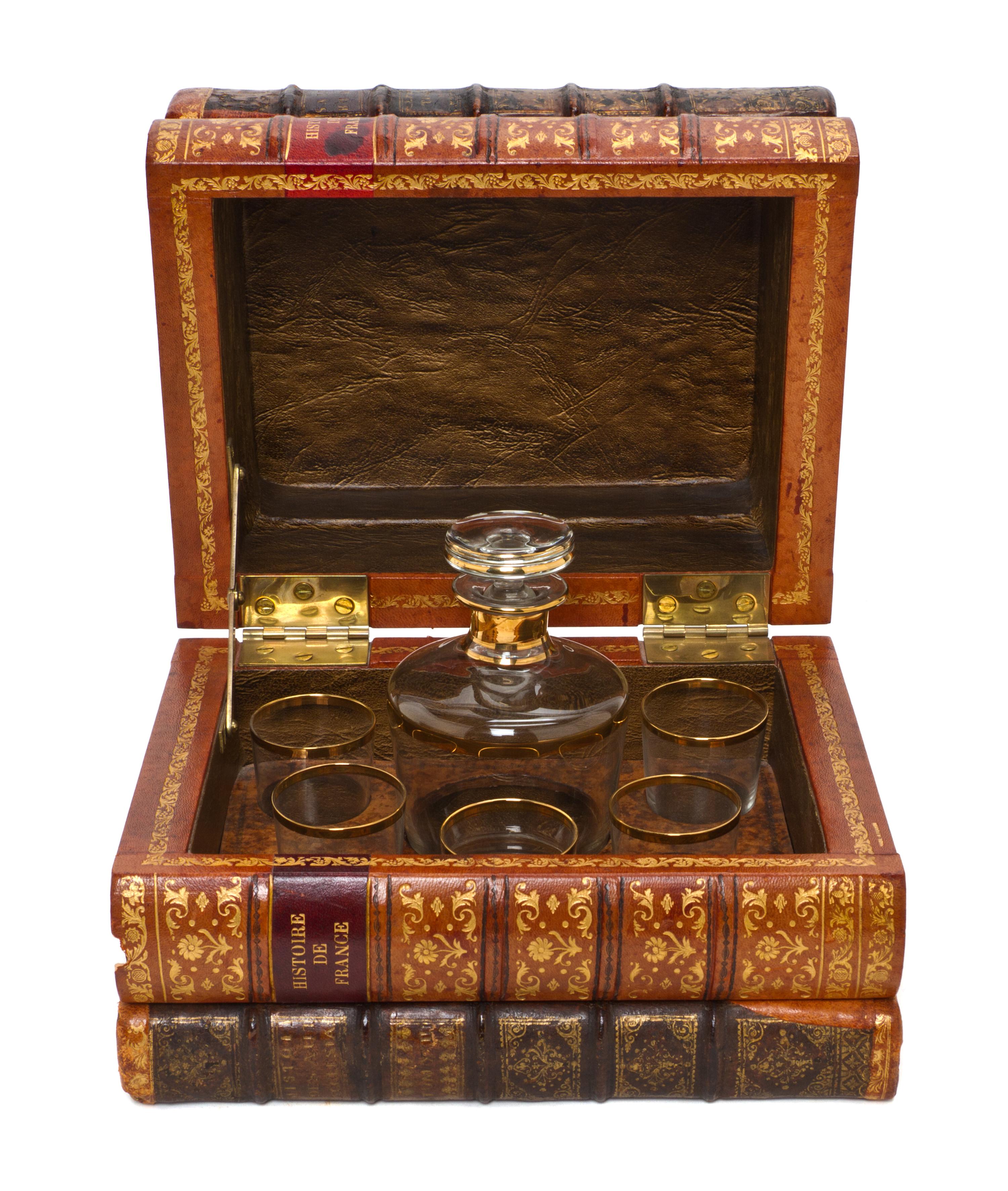 A French Book Form Decanter Set, Height 7 1/2 x width 10 1/8 x depth 8 inches.