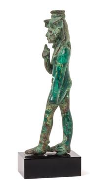 An Egyptian Bronze Striding Harpokrates Height 5 3/4 inches. — LATE PERIOD, DYNASTY 26-30, 664-343 B.C.E.