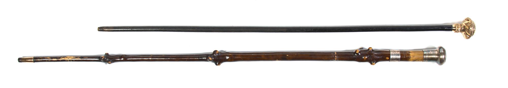 Two Victorian Walking Sticks, Height of taller overall 35 3/4 inches.
