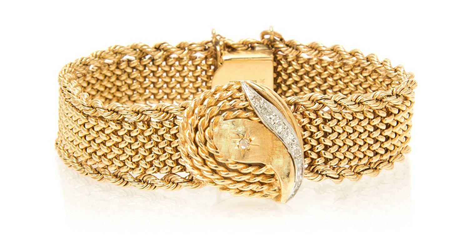 A 14 Karat Yellow Gold and Diamond Surprise Wristwatch, 29.30 dwts.