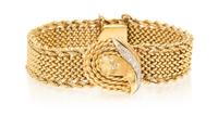 A 14 Karat Yellow Gold and Diamond Surprise Wristwatch, 29.30 dwts.