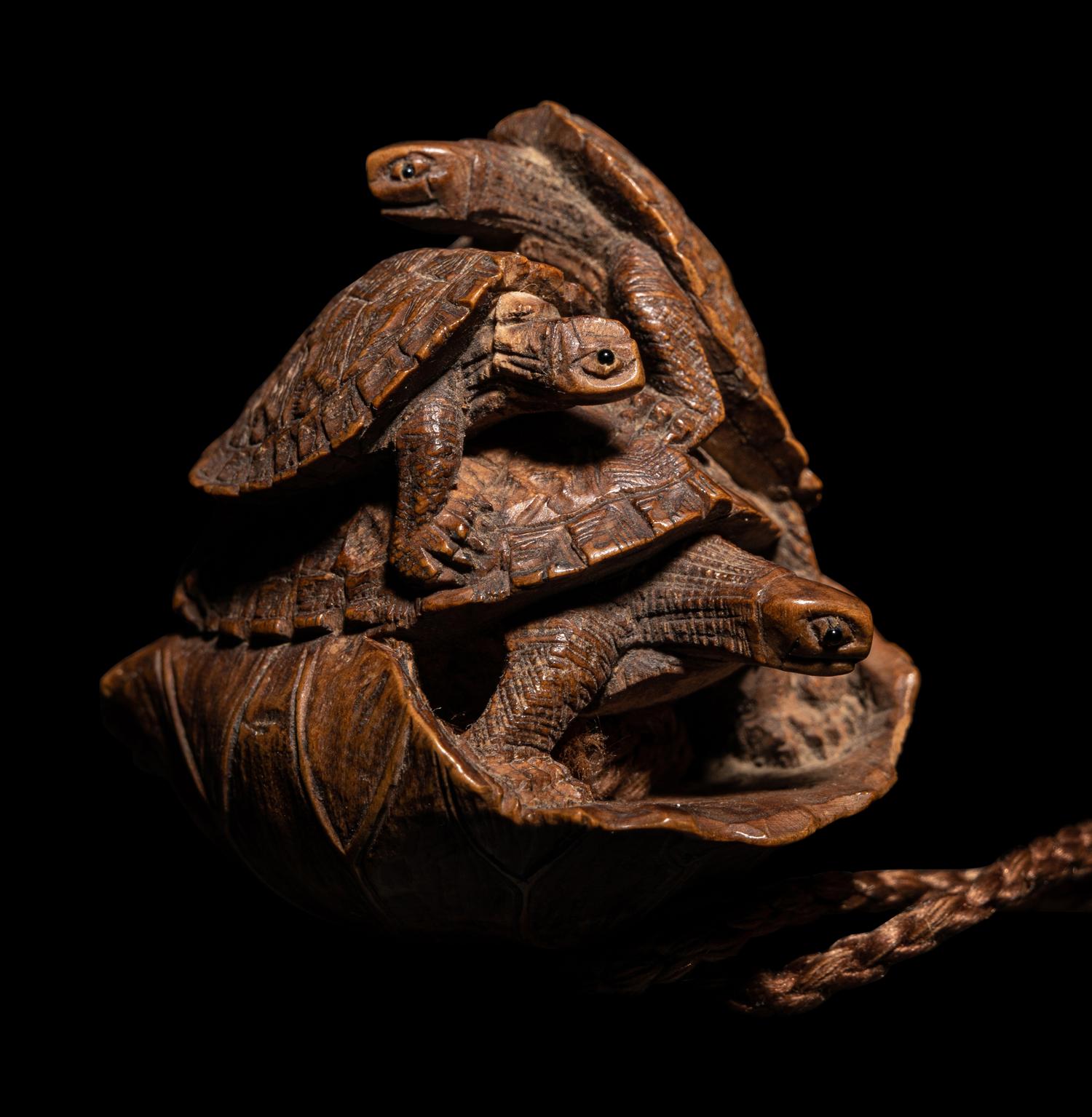 A Japanese Terrapin-Form Boxwood Three- Case Inro, Ojime and Netsuke