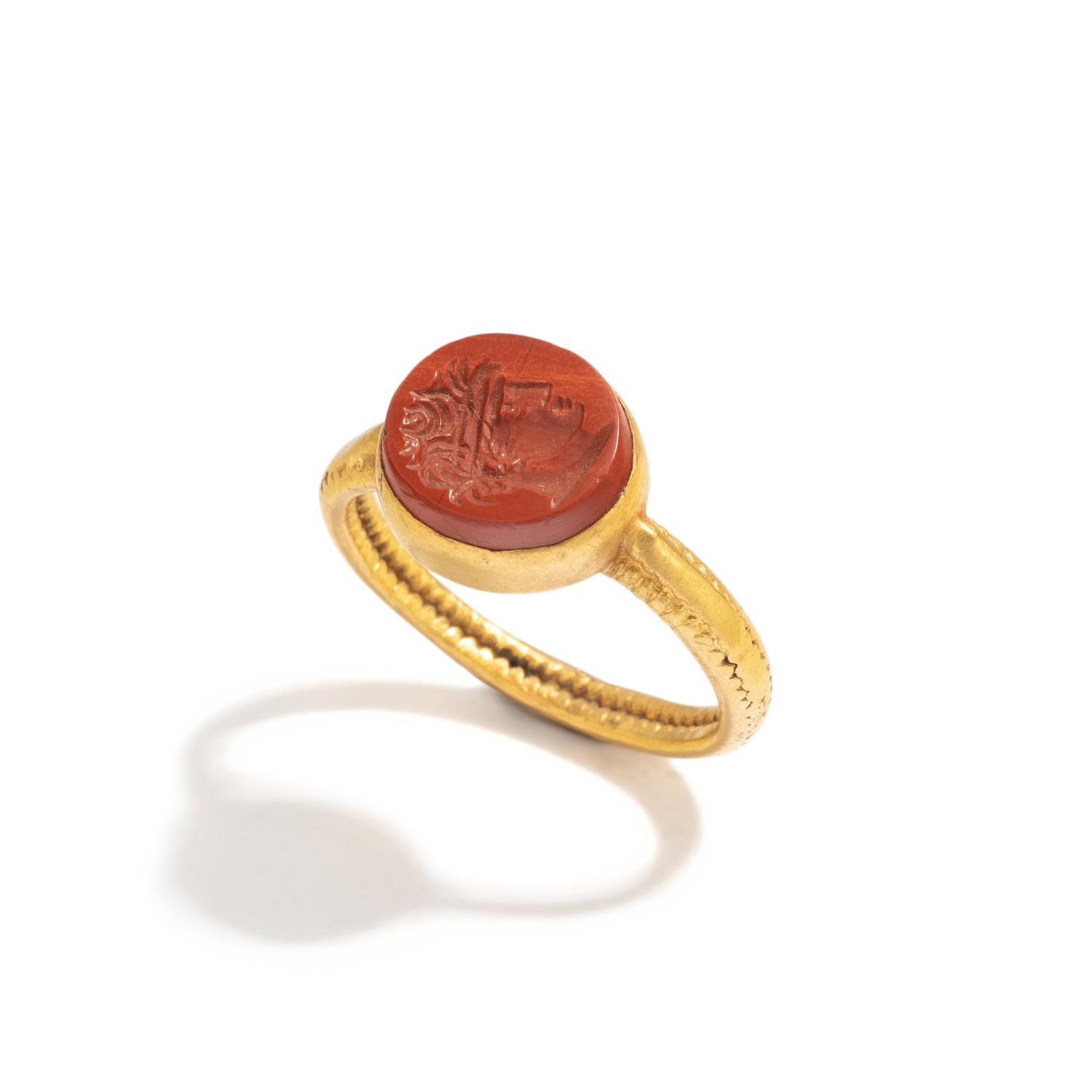 A Roman Gold and Red Jasper Ring Stone with a Portrait Head of an Athlete